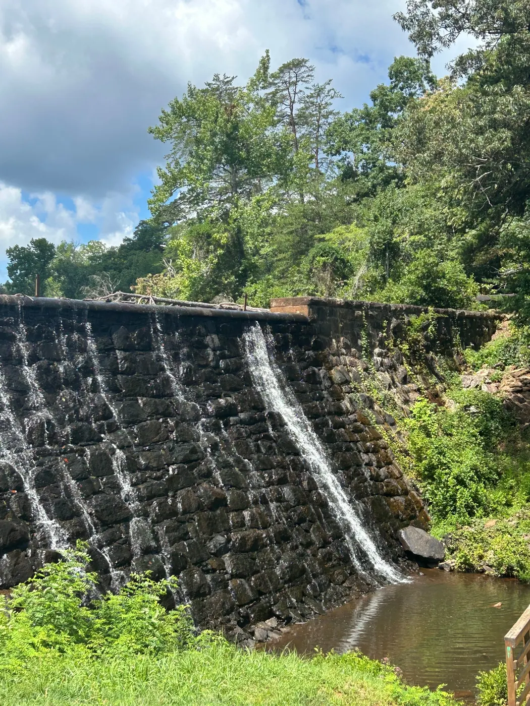 Historic stone dam and waterfall at Paris Mountain State Park, near the White Oak Digital office in Greenville, South Carolina.